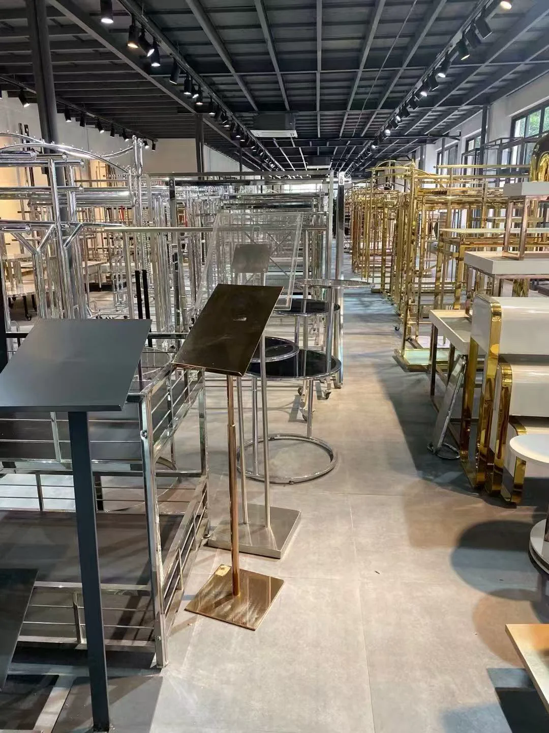 Metal and gold hanger racks displayed in the Fanan Display showroom