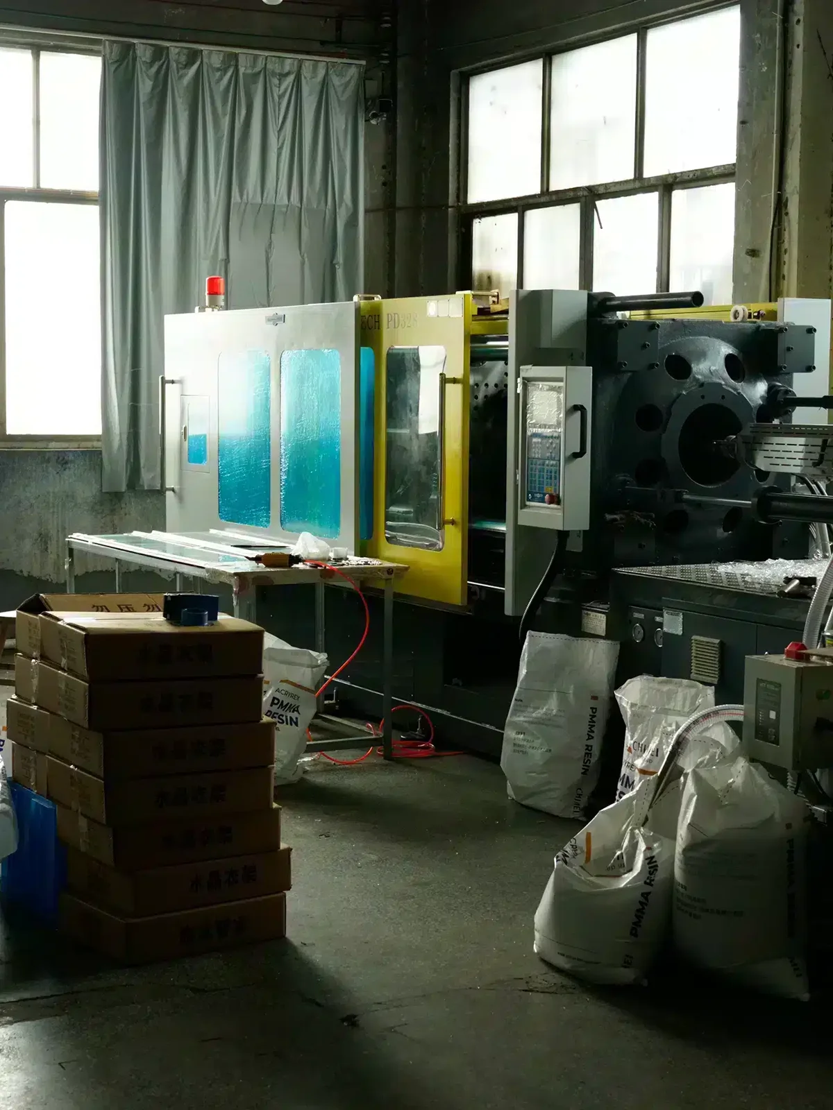 Injection moulding machine and raw material on the Fanan Display production line