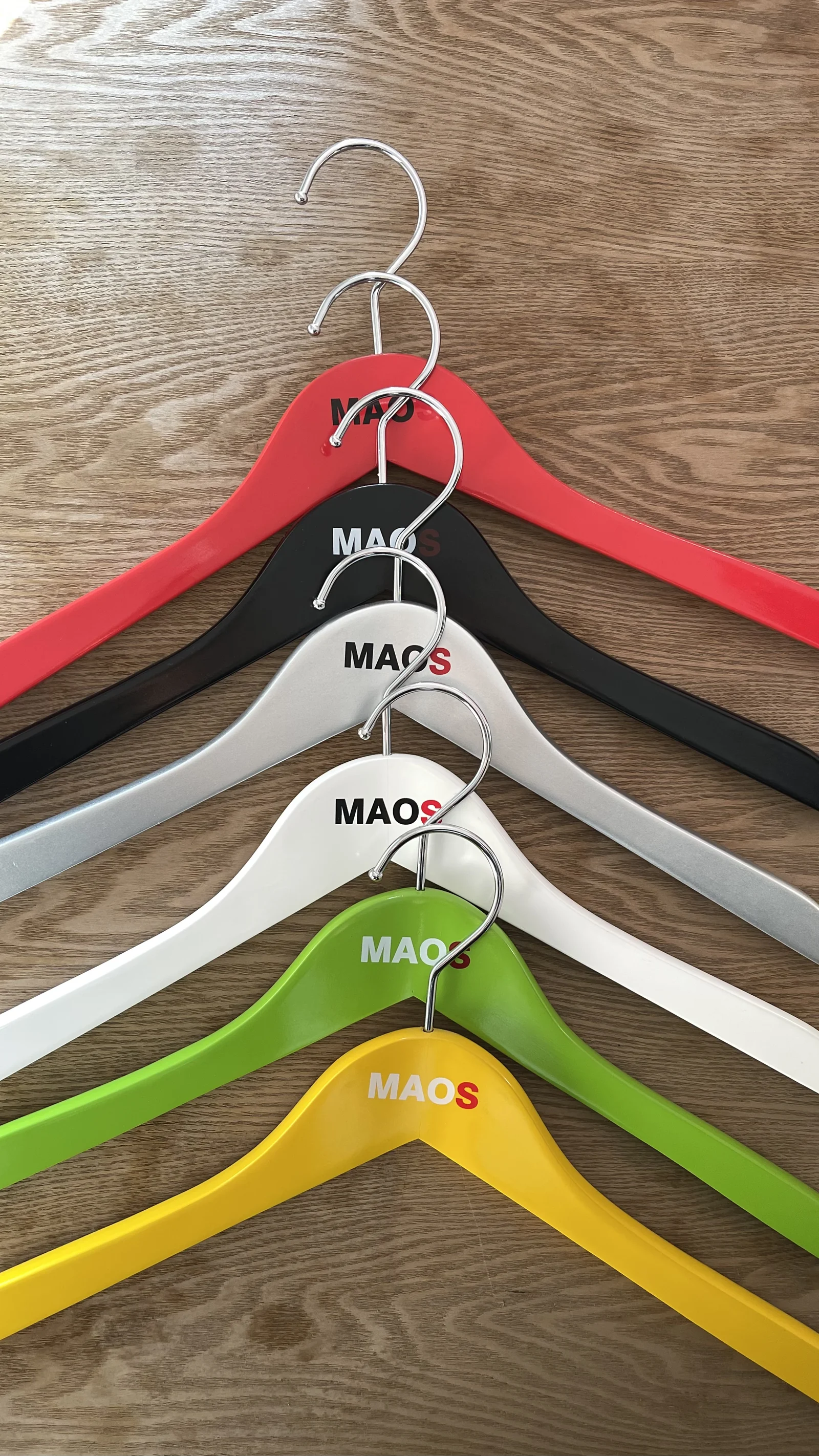 Painted Wooden Hangers with Custom Branding for a Dubai Store