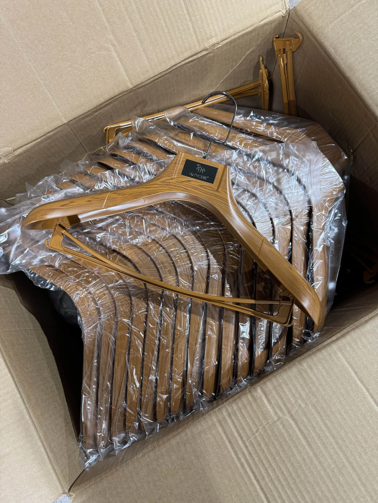 Plastic Suit Hangers with Wood Grain for a Taizhou Suit Store