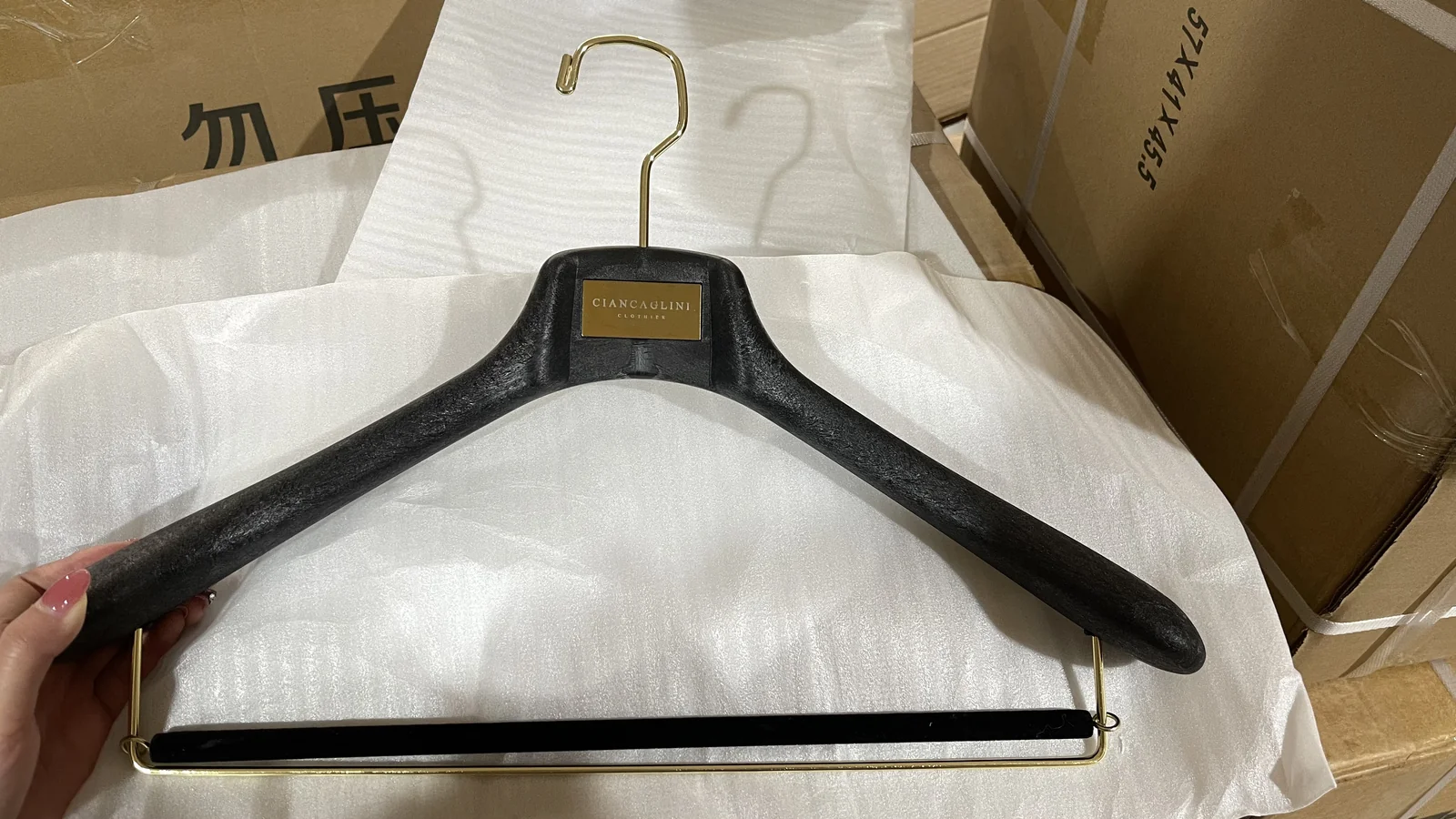 Resin Suit Hangers with Gold Nameplate for a Shanghai Store